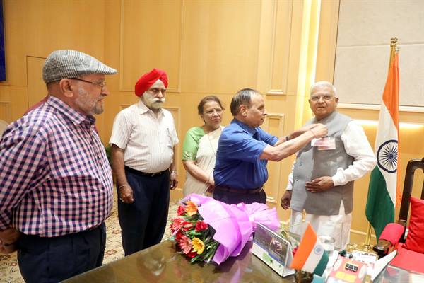 Flag pinned on Governor on Flag Day