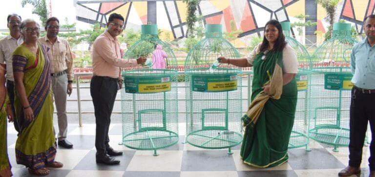 Principal Secretary Mr. Bora placed the empty bottle in the container