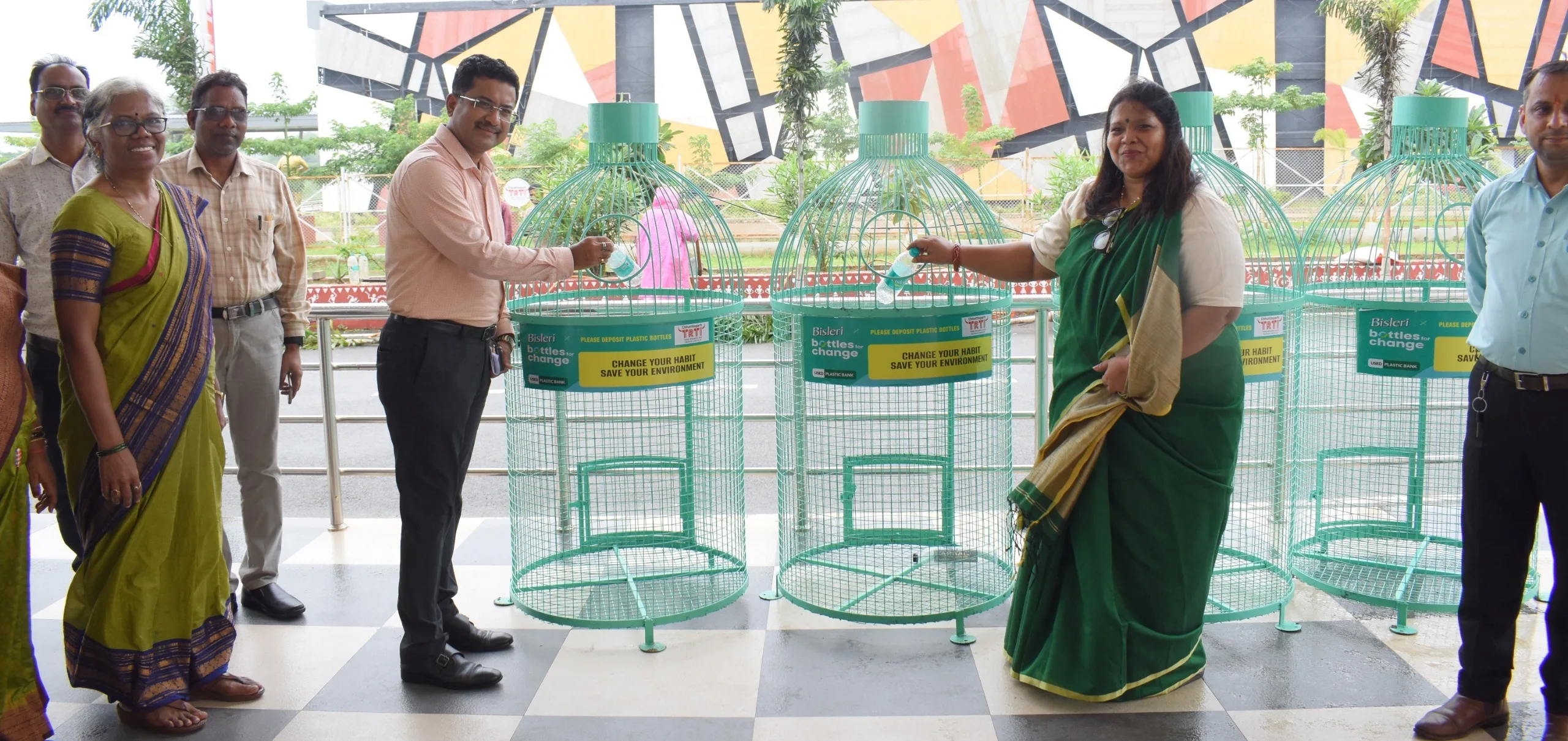 Principal Secretary Mr. Bora placed the empty bottle in the container